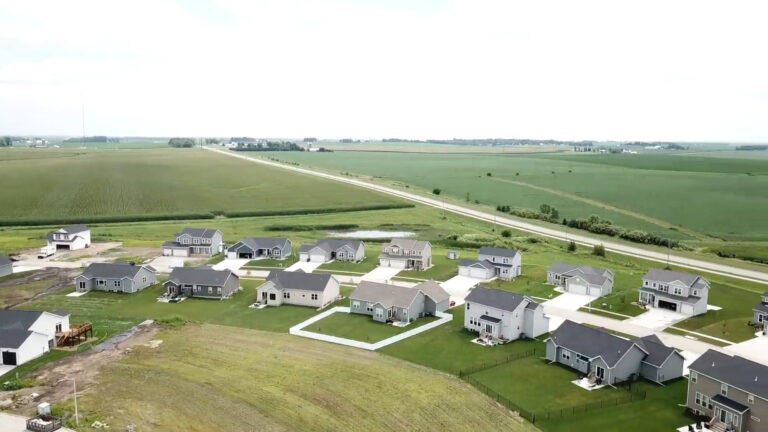 Small town Audubon in Iowa, drone view of field and houses